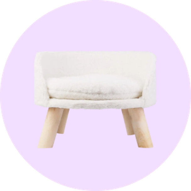 Upholstered pet sofa with wooden legs on a lavender background