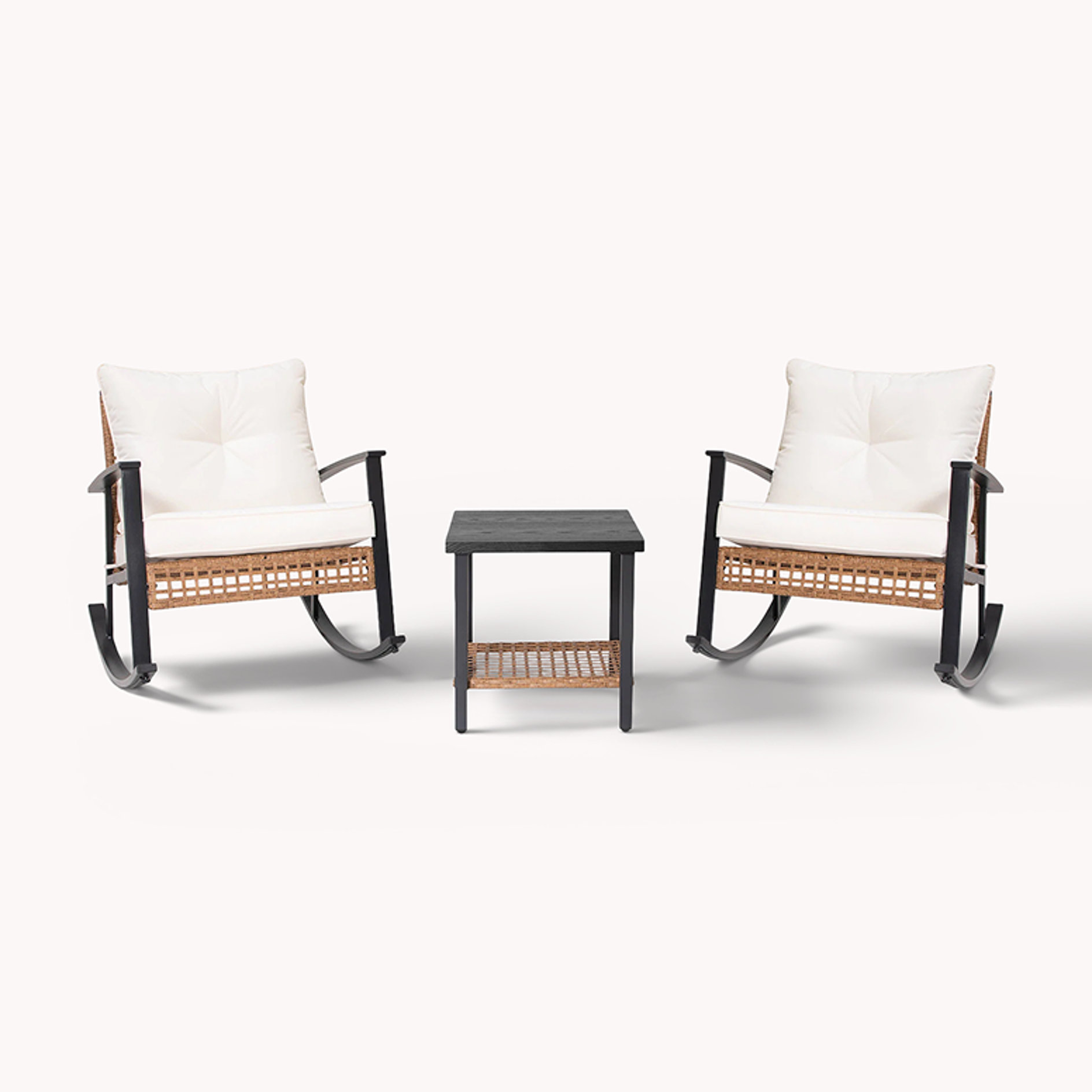 Two rocking chairs with cream cushions and side table