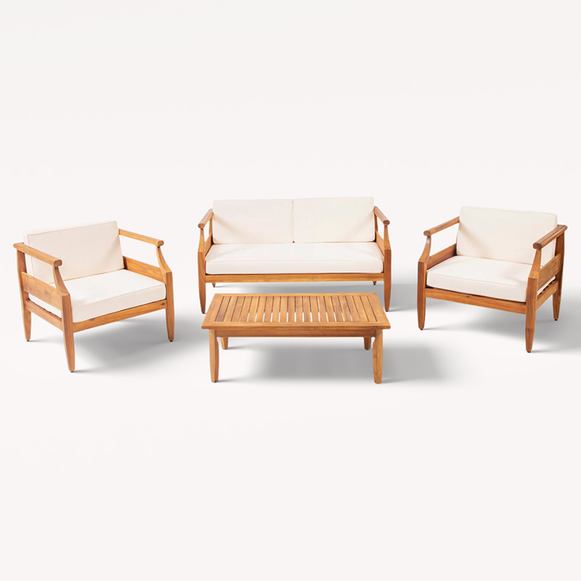 4-piece teak conversation set with cream cushions and coffee table