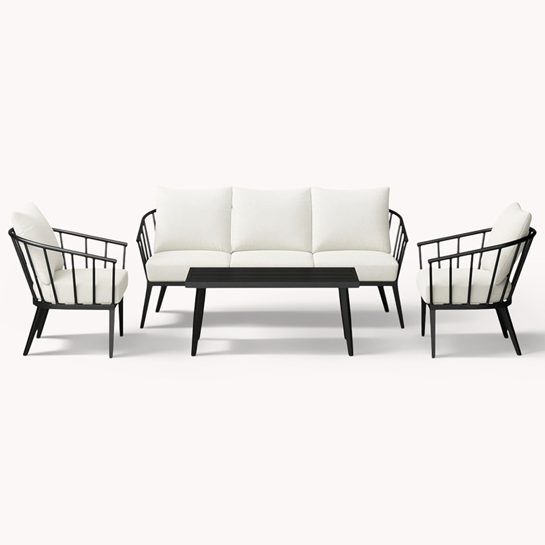 Black metal conversation set with white cushions and coffee table
